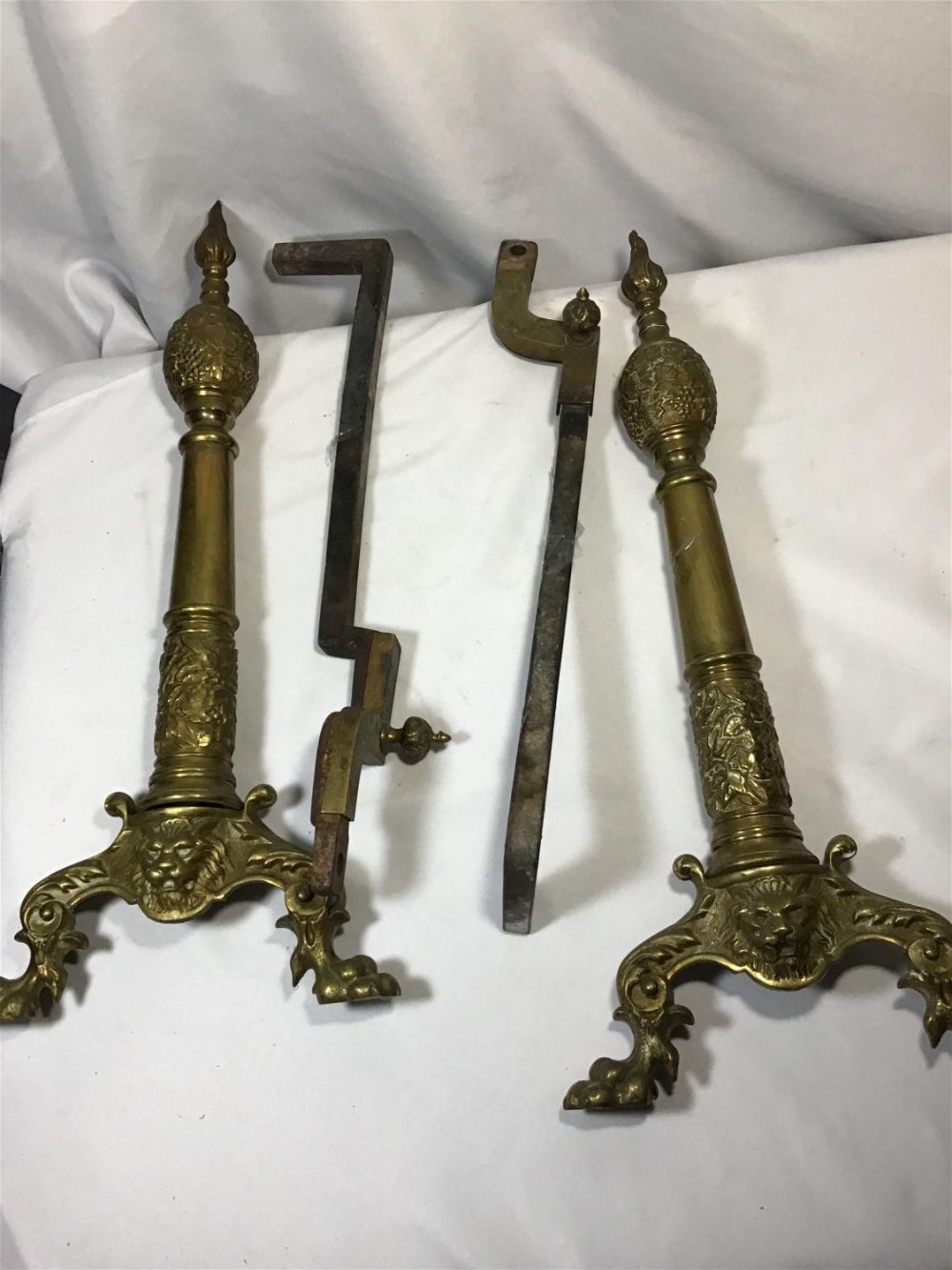 Lot 203: Solid Brass Andirons Center post is iron Each measures 2 feet tall