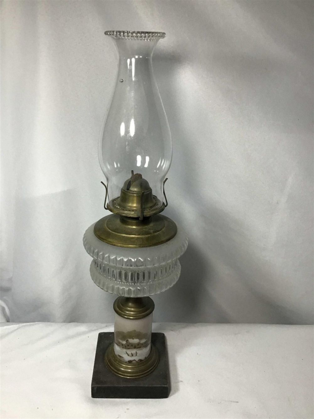 Lot 205: Hand Painted Base Oil Lamp Measures 20 inches tall with shade