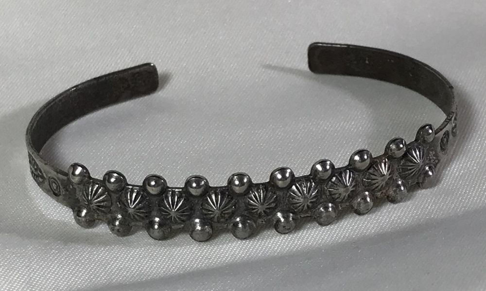Lot 153: Native American Motif Bracelet .