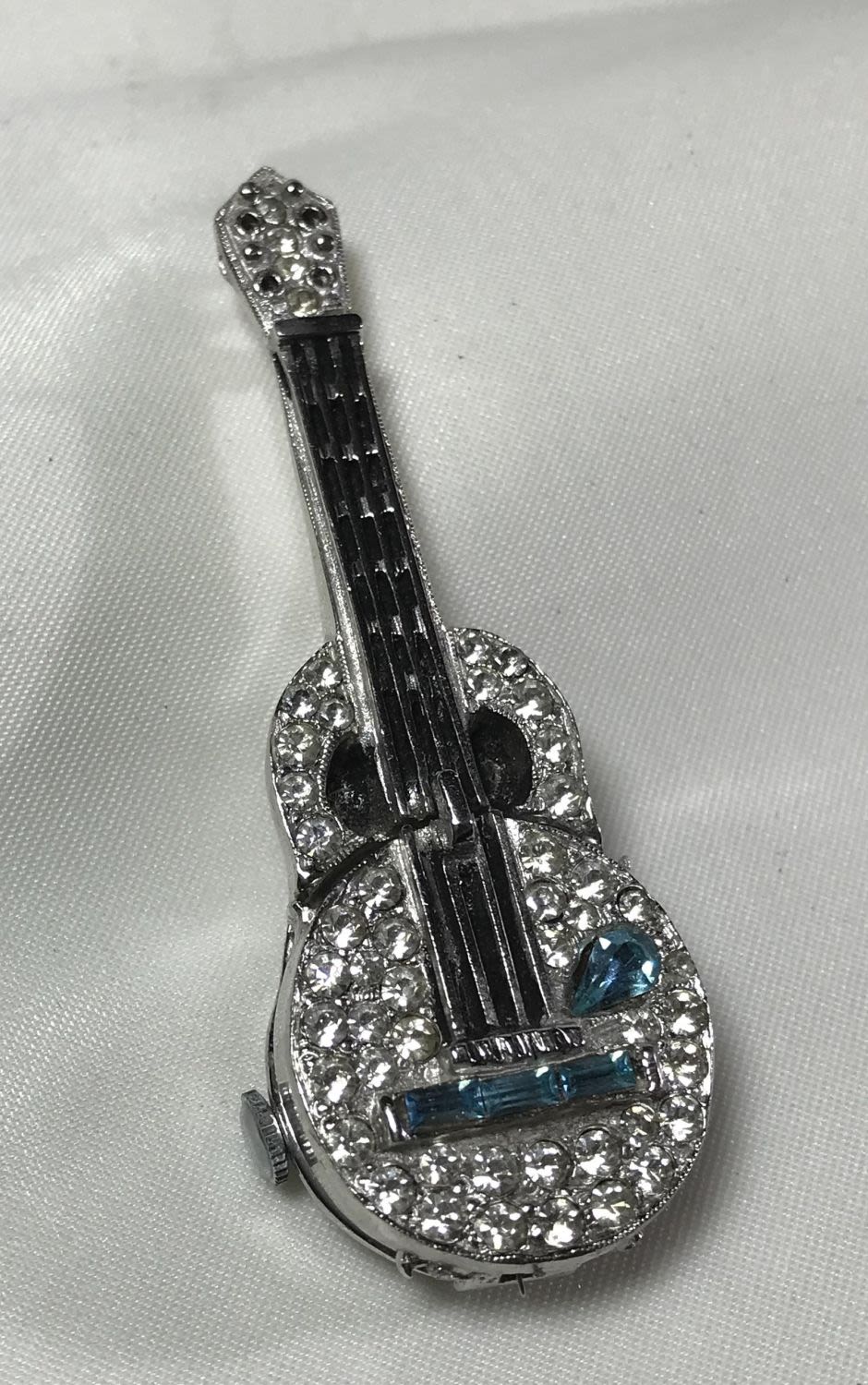 Lot 156: Guitar Brooch w/ Clock Inside Measures 2.5 inches
