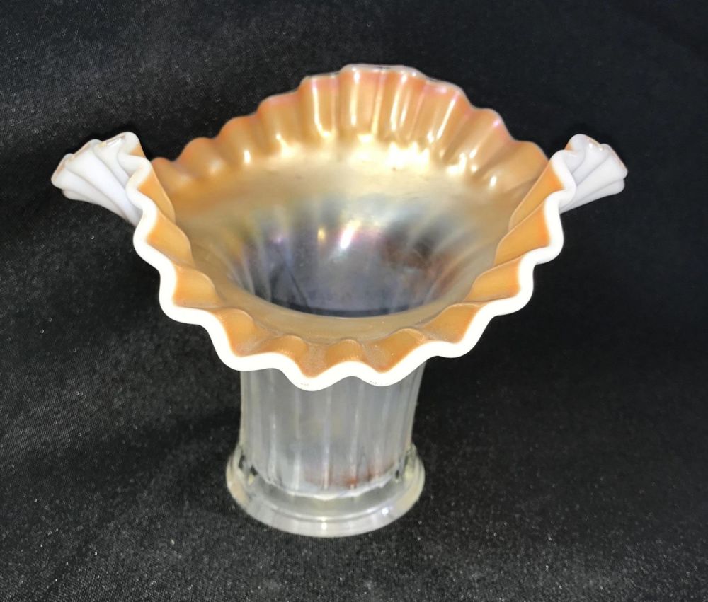 Lot 185: Vintage Ribbon Glass Vase Measures 5 inches tall by 7 inches wide