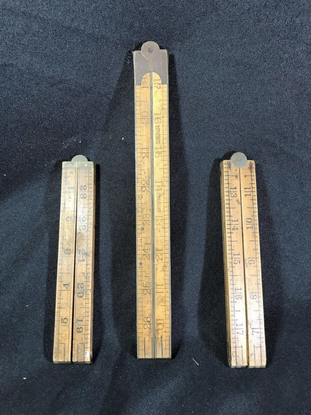 Lot 201: Vintage Folding Rulers (3) .