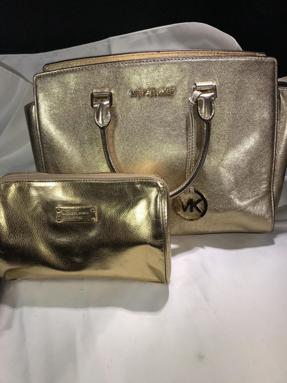 Lot 156: Michael Kors Gold Purse w/ Makeup Bag .