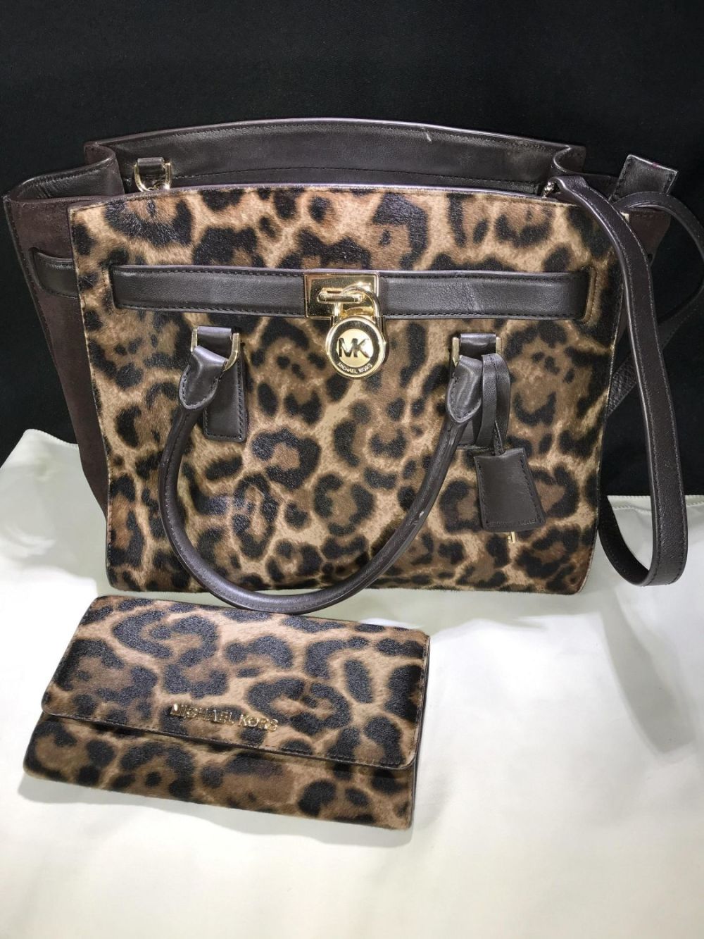 Lot 172: Michael Kors Leopard Style Purse w/ Matching Wallet .