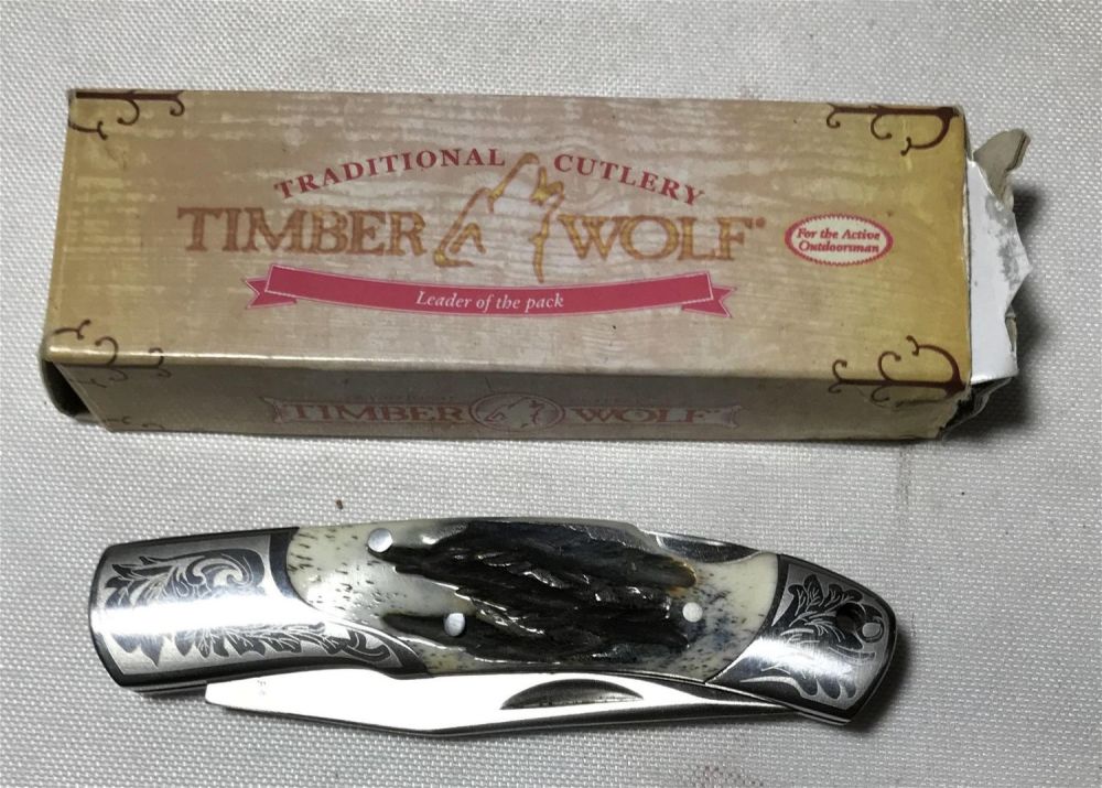 Lot 200: Timber Wolf Pocket Knife in org box .
