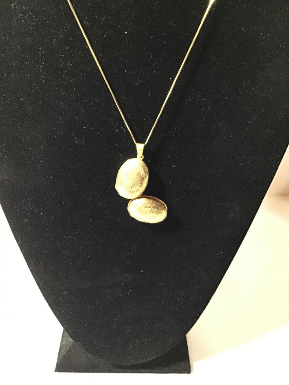 Lot 175: Gold tone  4 picture locket - Sterling piece