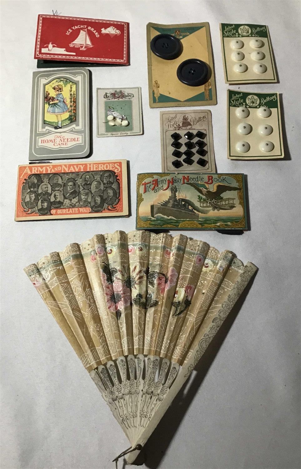 Lot 179: Vintage needle and button collection with fan