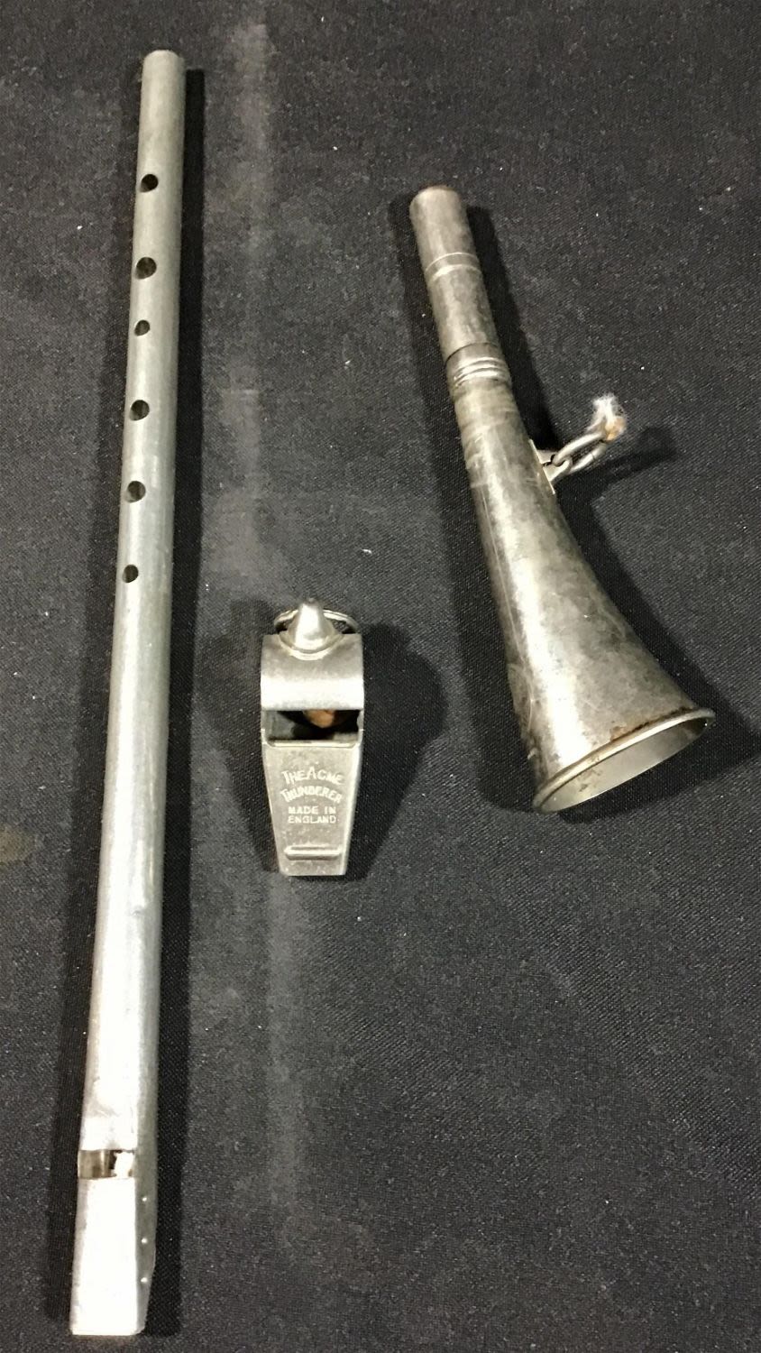 Lot 217: Three collectible whistles
