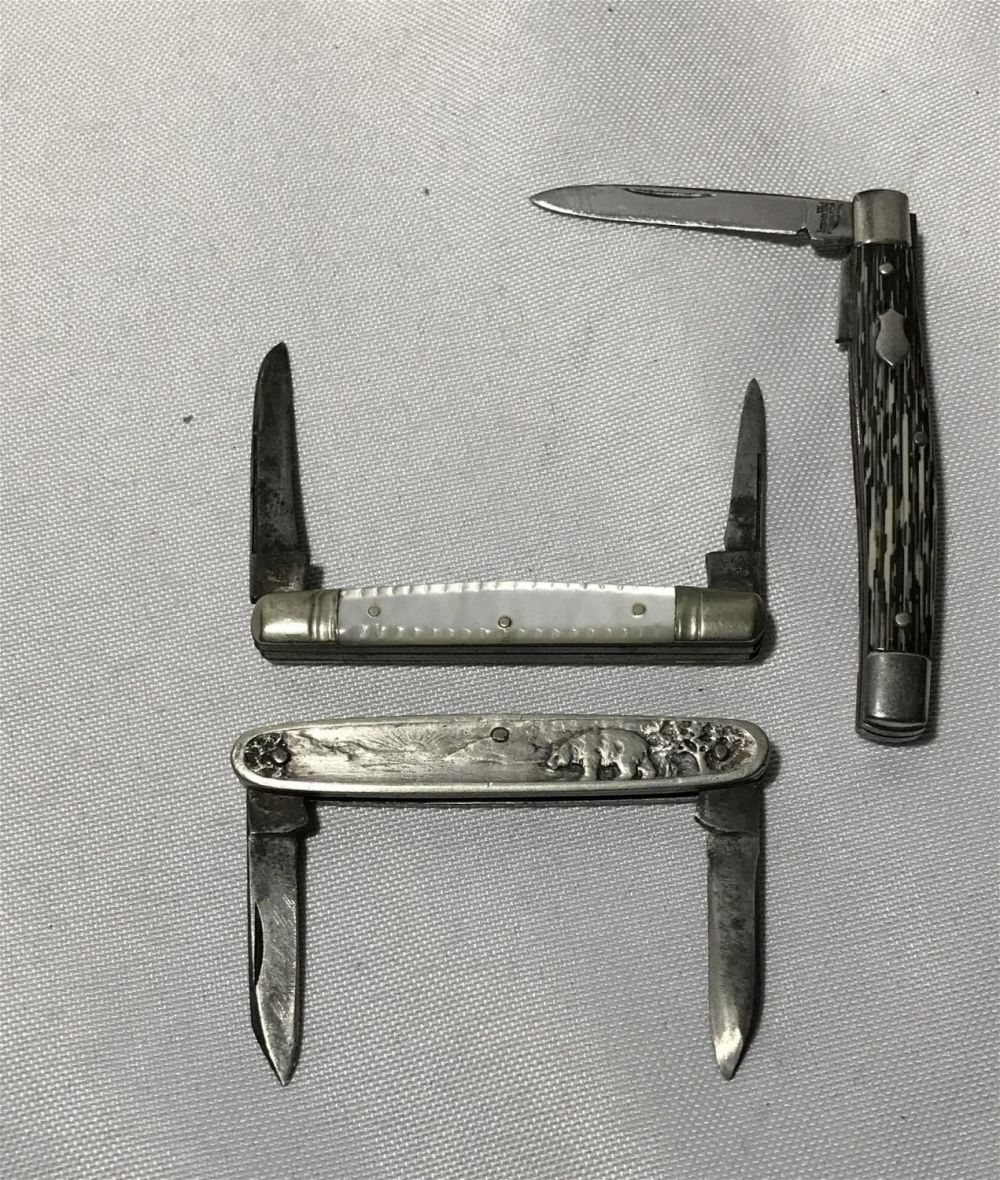 Lot 264: Three vintage pocket knives one scenic one mother
