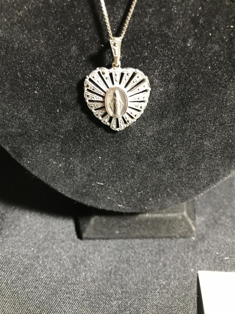 Lot 202: Sterling Immaculate Mary with Heart and Chain .