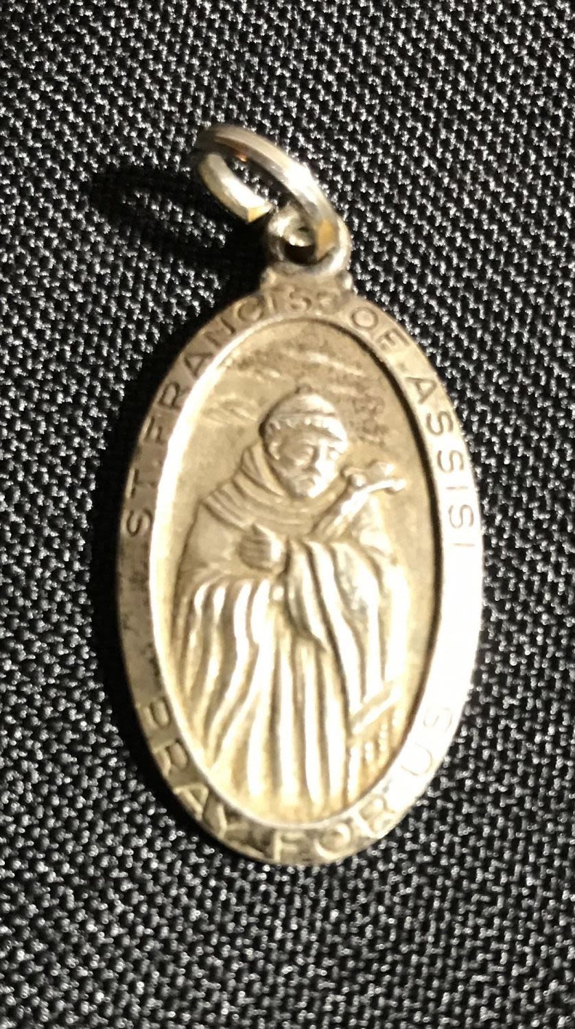 Lot 206: Sterling Saint Francis of Assisi "pray for us" metal