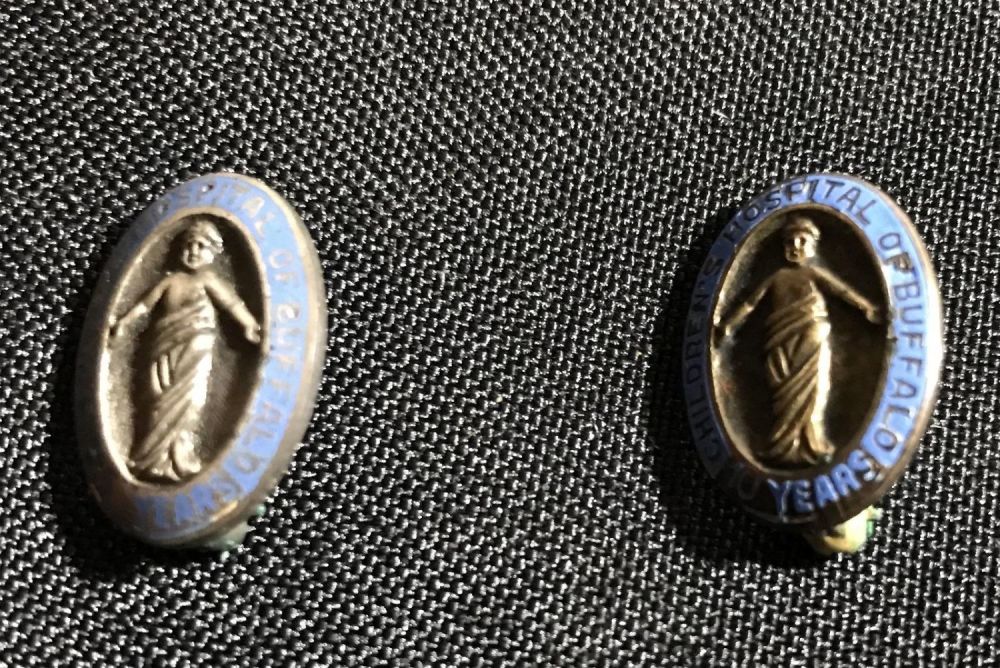 Lot 248: Vintage Childrenâ€™s Hospital 5 &  10 year service pin one silver