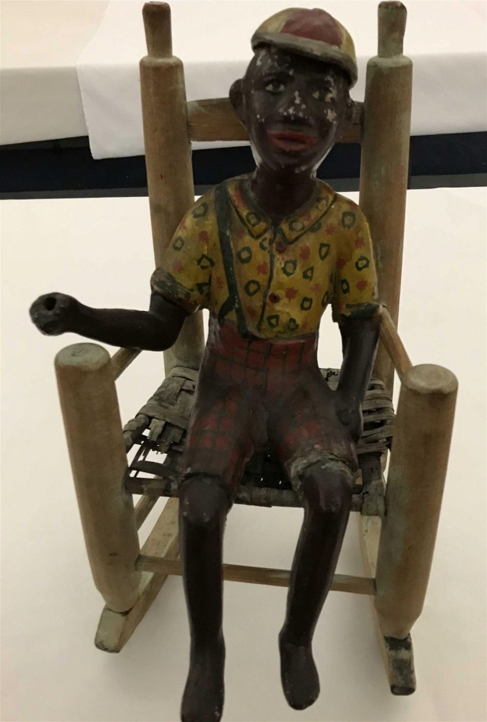 Lot 160: Black Americana Fisherman in Rocker