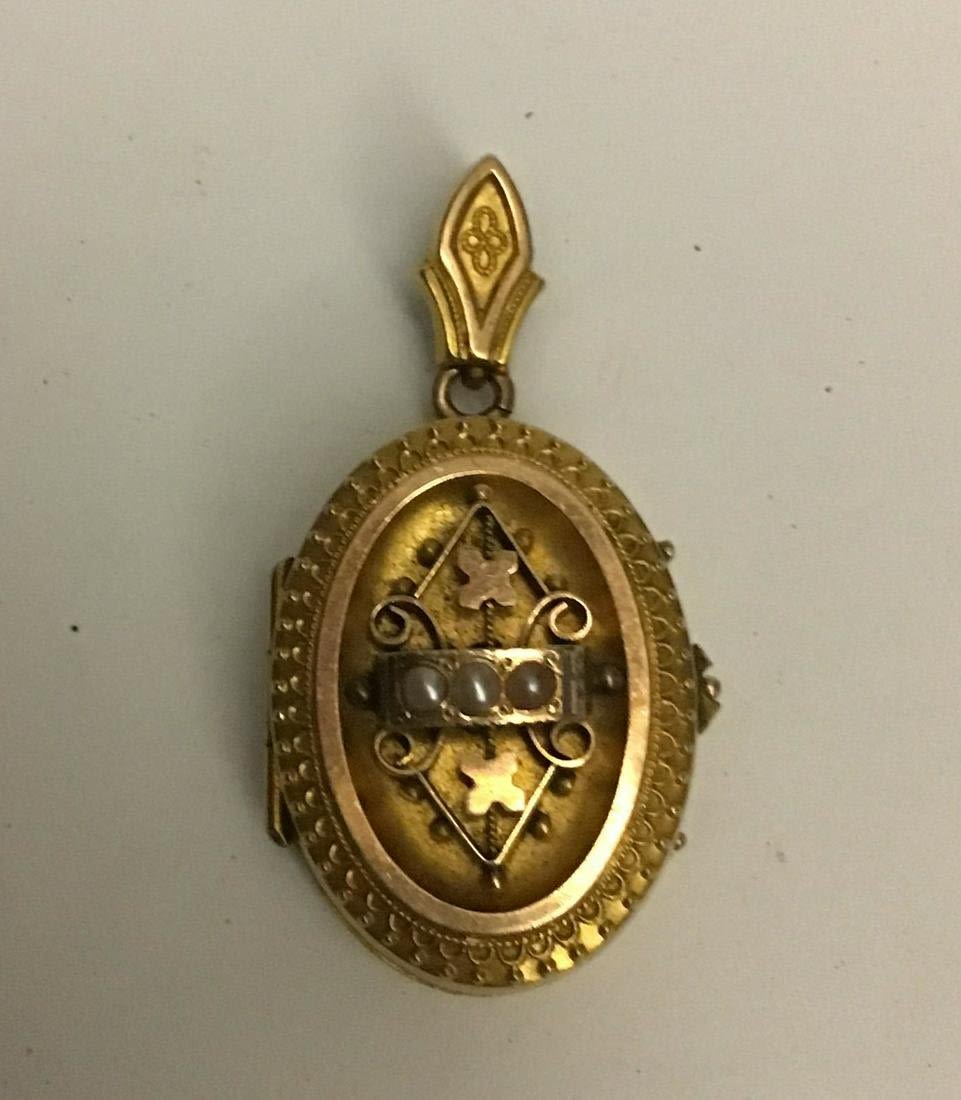 Lot 306: Pinchback Gold Locket w/ 3 Seed Pearls