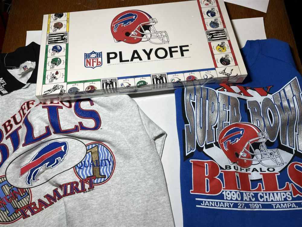 Lot 183: Buffalo Bills Collection: Playoff Board Game With 2 Sweatshirts, 1 labeled XL and the other appears