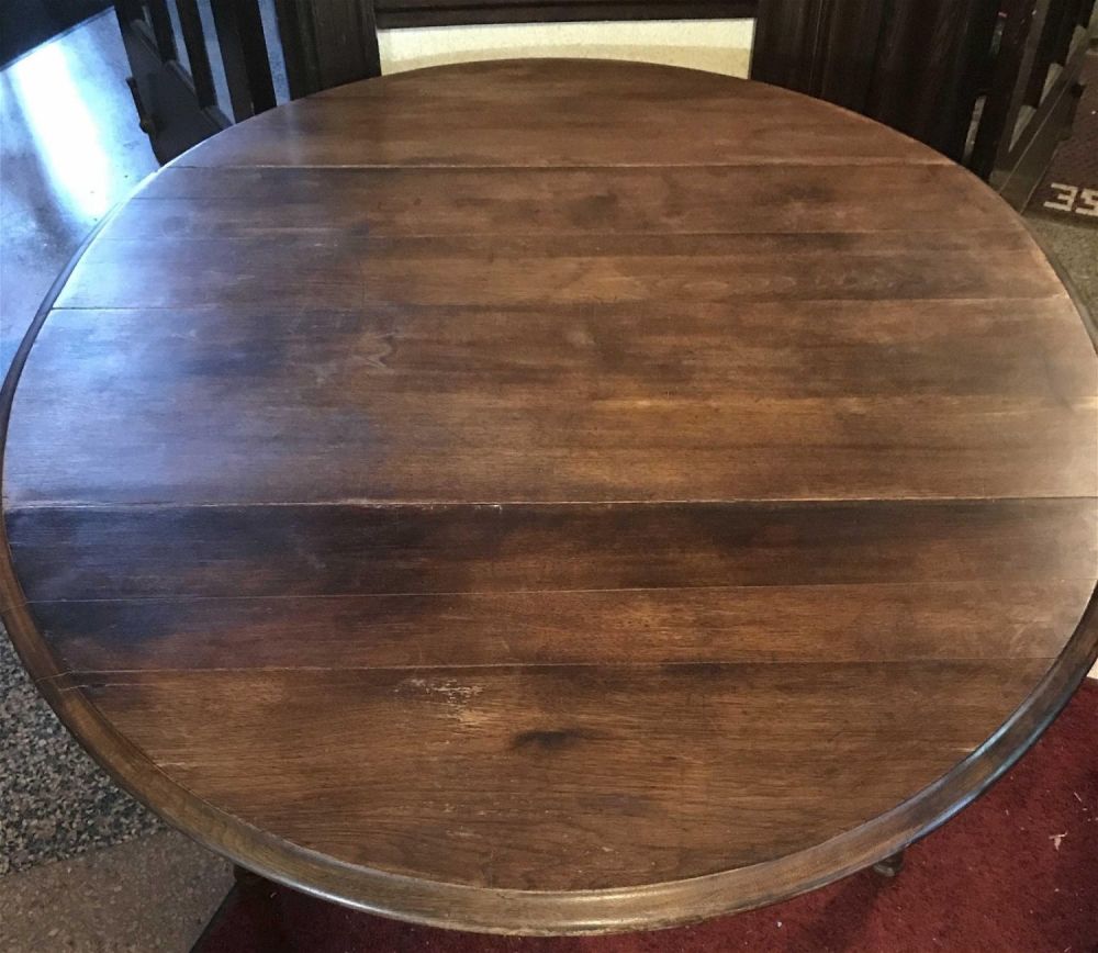 Lot 191: Vintage Drop Leaf Table measuring 58 inches across five 45 x 28â€ high With five legs