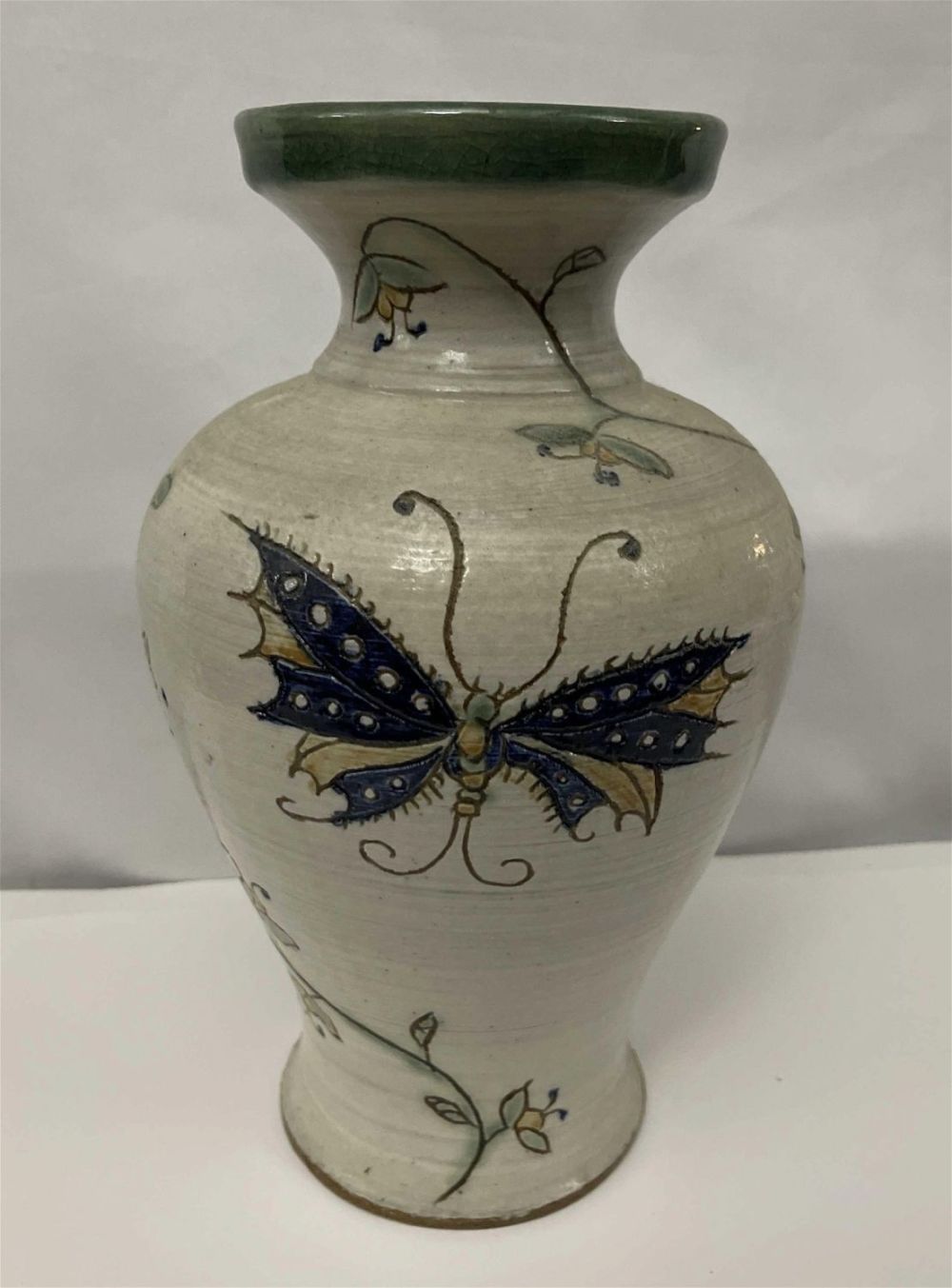 Lot 200: Butterfly Design Stoneware Vase, signed by JP measures  11 inches tall by 7 inches wide