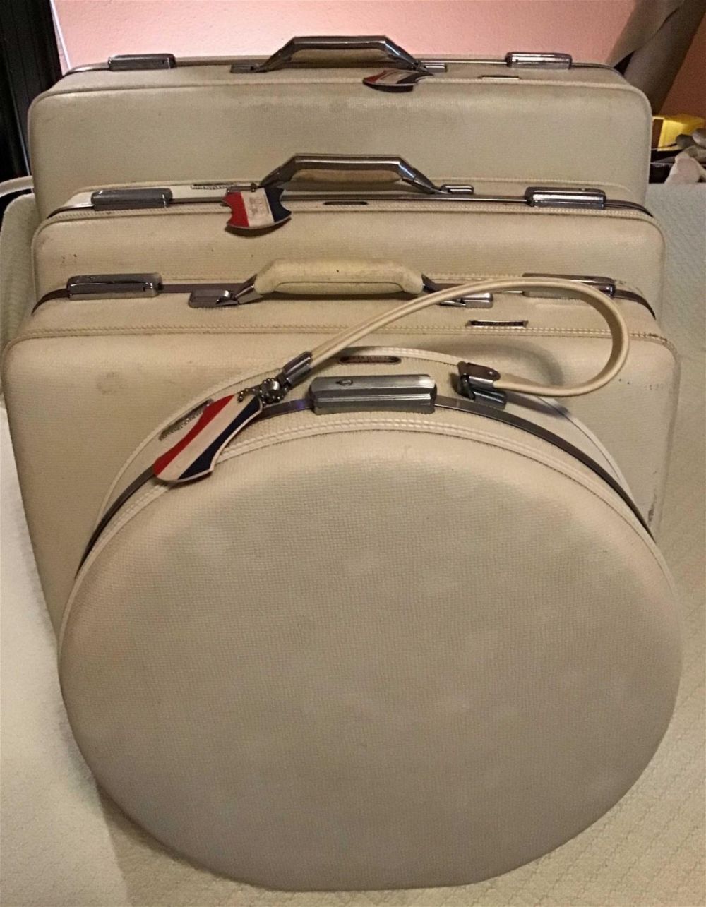 Lot 239: American Tourister Luggage - 4 piece set smallest  piece of luggage measures 16 inches around,  next