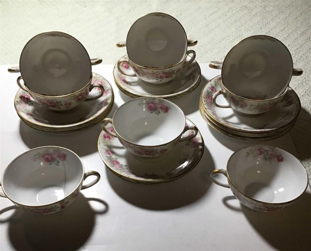 Lot 242: Elite works LIMOGES, France, Higgins, and SEITER, New York Tea cup and saucer set 9 cups, 10