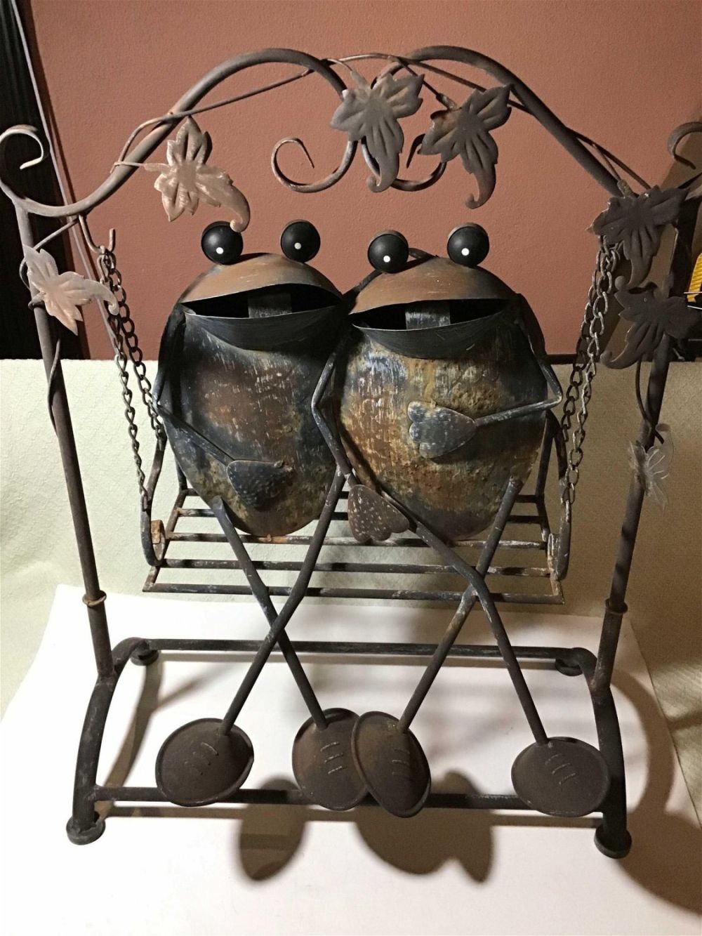Lot 244: Garden Art - Frogs Sitting on a Swing sturdy metal construction measures 21 x 26 Quite whimsical
