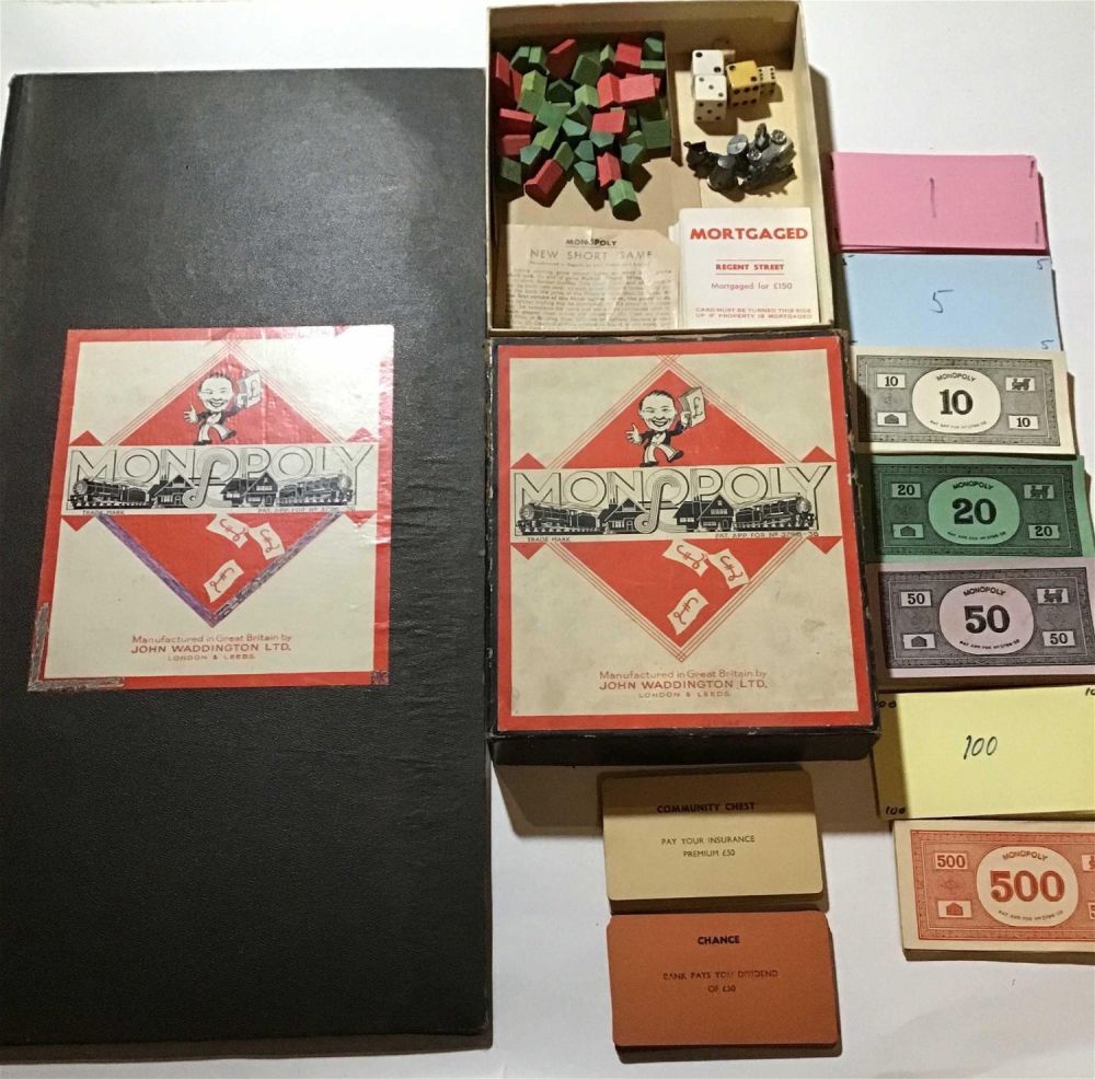 Lot 245: Early Monopoly Game Ones fives and $100bills have been replaced with paper, everthything pictured is