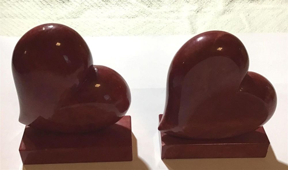 Lot 246: Heart Shaped Bookends- made of marble Each measures 6 1/2 inches high, Chip on bottom of one