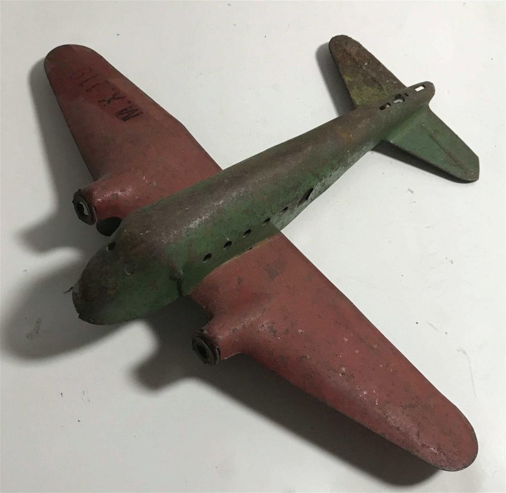 Lot 295: Vintage Metal Plane Toy measures 9 1/2" across and 7" long