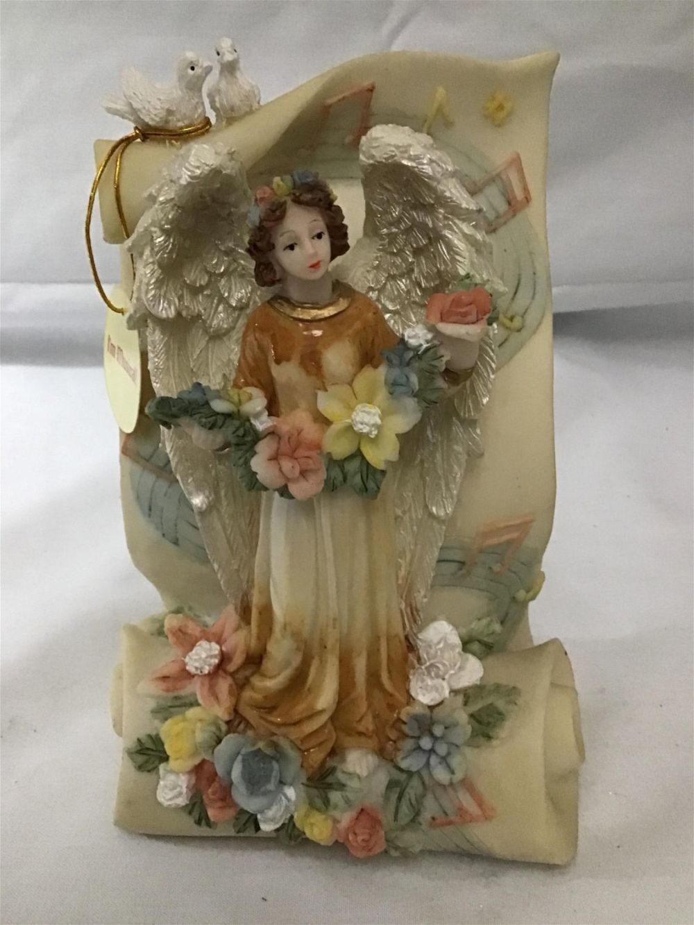 Lot 294: Angel Holding Flowers with Music Notes