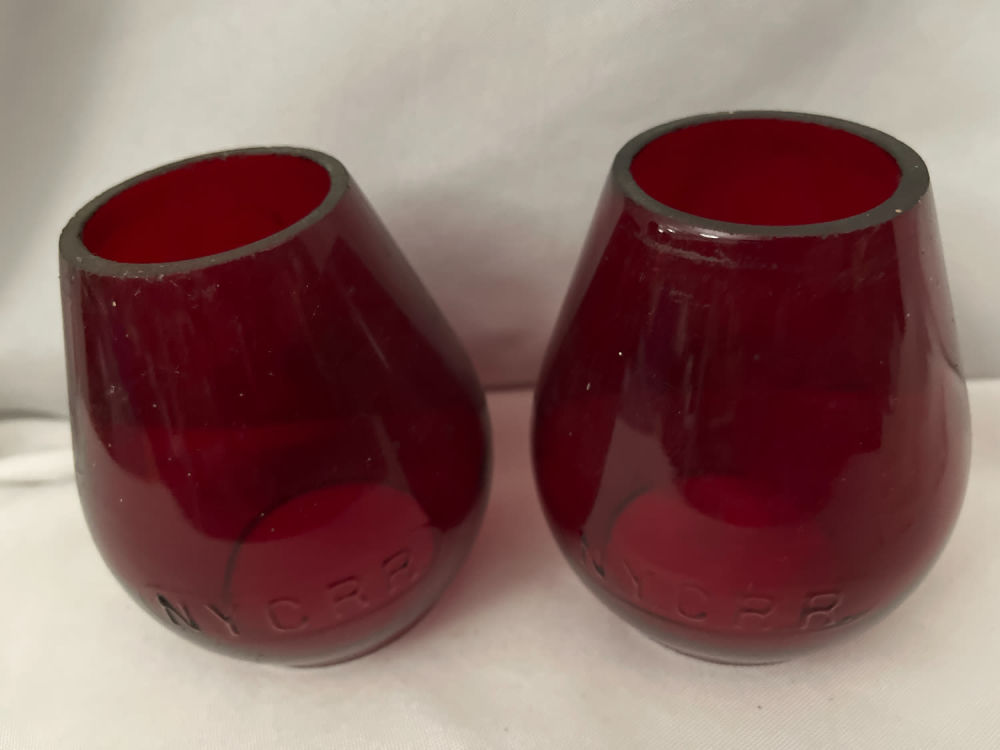 Lot 293: NY Central RR Globes (2) red cut Glass