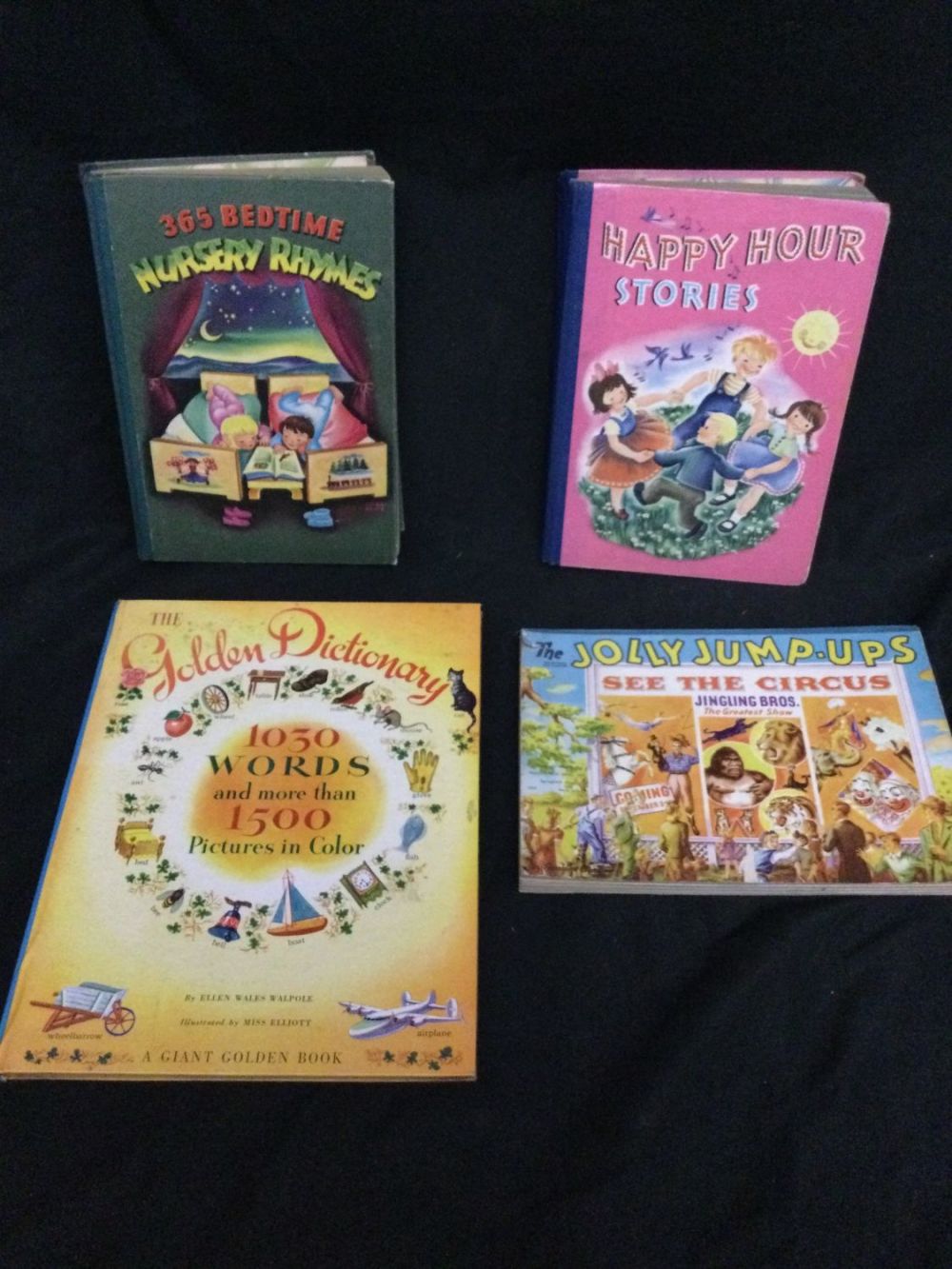Lot 265: Four children’s hard cover books including