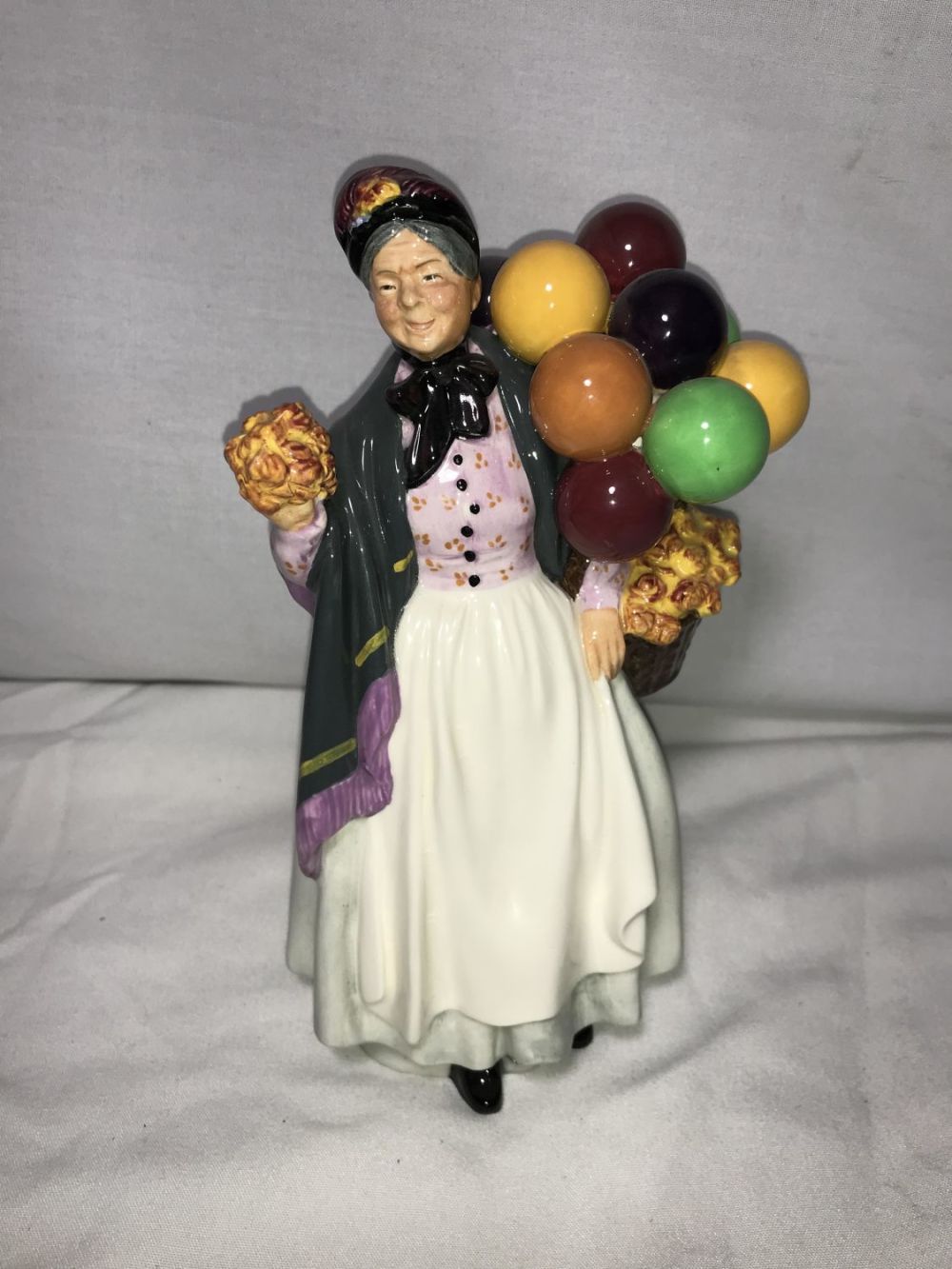 Lot 230: Royal Doulton Biddy Pennyfarthing Figure