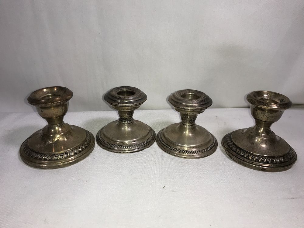 Lot 185: Sterling Weighted Candle Holders (4)