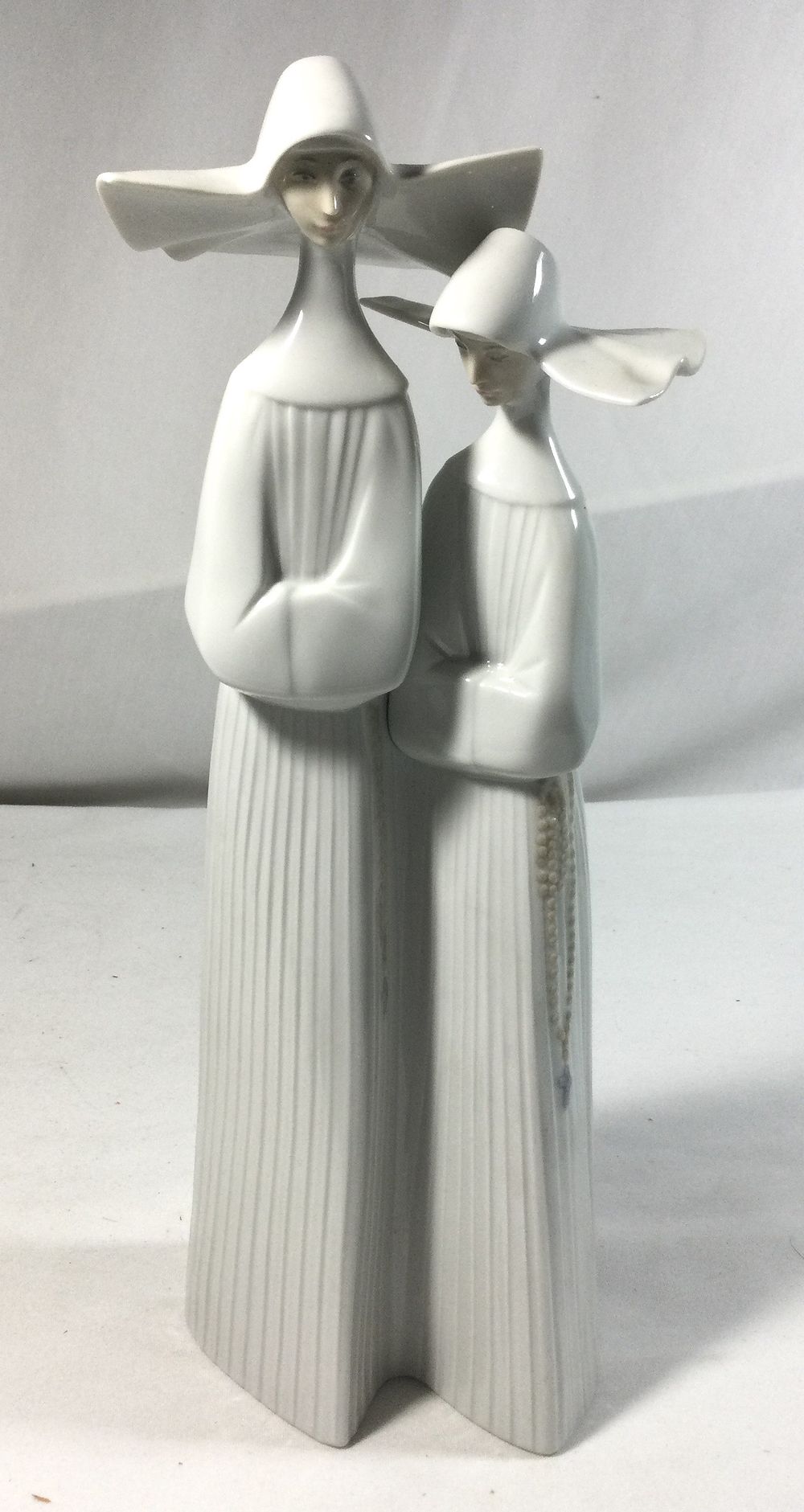 Lot 342: Lladro figurine of two nuns with crossed arms
