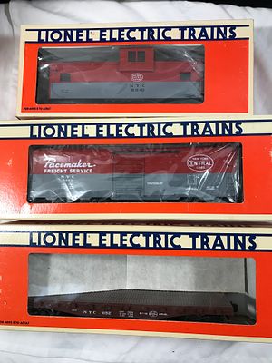 Lionel NYC 3 Car Collection All in original boxes. Including: 6521 Flat Car with Stakes, 9469 