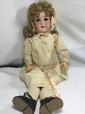 German Bisque Head Doll. Measures Approximately 23 inches from feet to the top of the head 