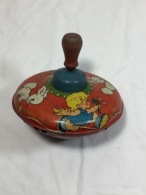 Vintage Lithograph Spinning Top Tin Toy. 1950s, designed to hum when spun, measures 