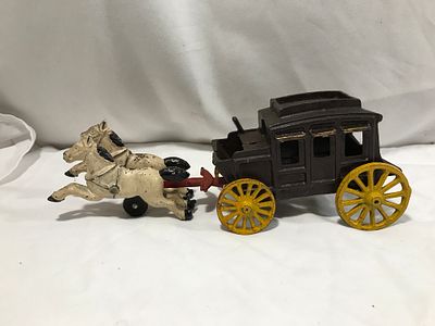 Vintage Cast Iron Horse Drawn Stagecoach. Measures a foot long