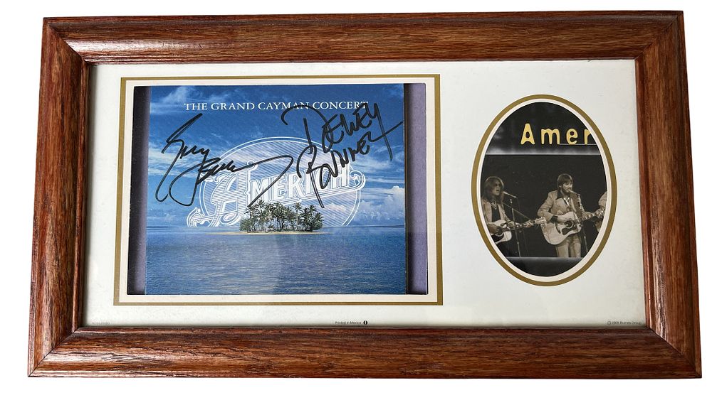 Lot 103: America Band Signed The Grand Cayman Concert CD Insert and Performance Photo Framed Display