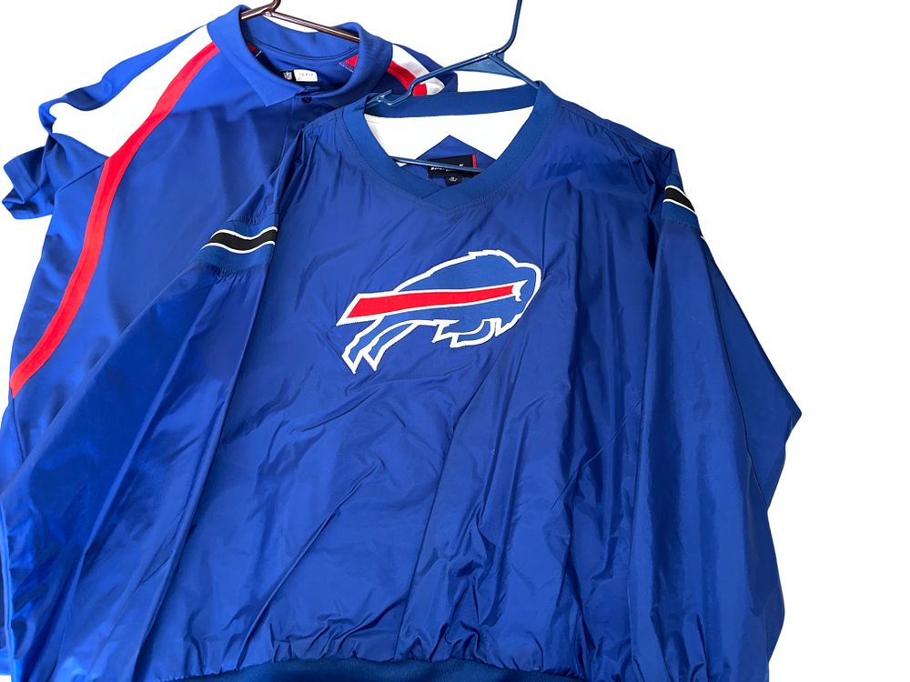 Lot 268f: Buffalo Bills NFL Fan Apparel Collection, Pullover Windbreaker, Polo, and Assorted T-Shirts
