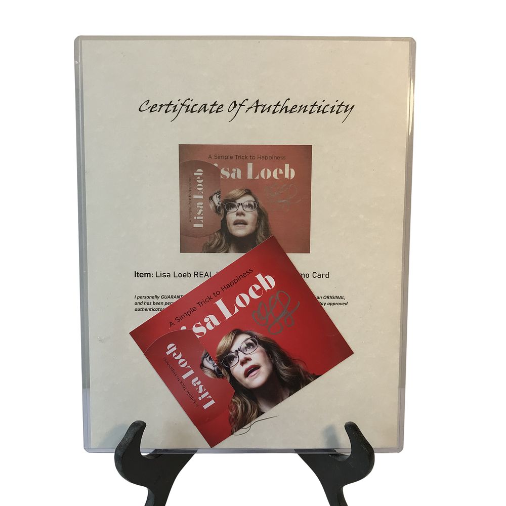 Lot 104a: Lisa Loeb Autographed A Simple Trick to Happiness Promotional Card and Certificate of Authenticity