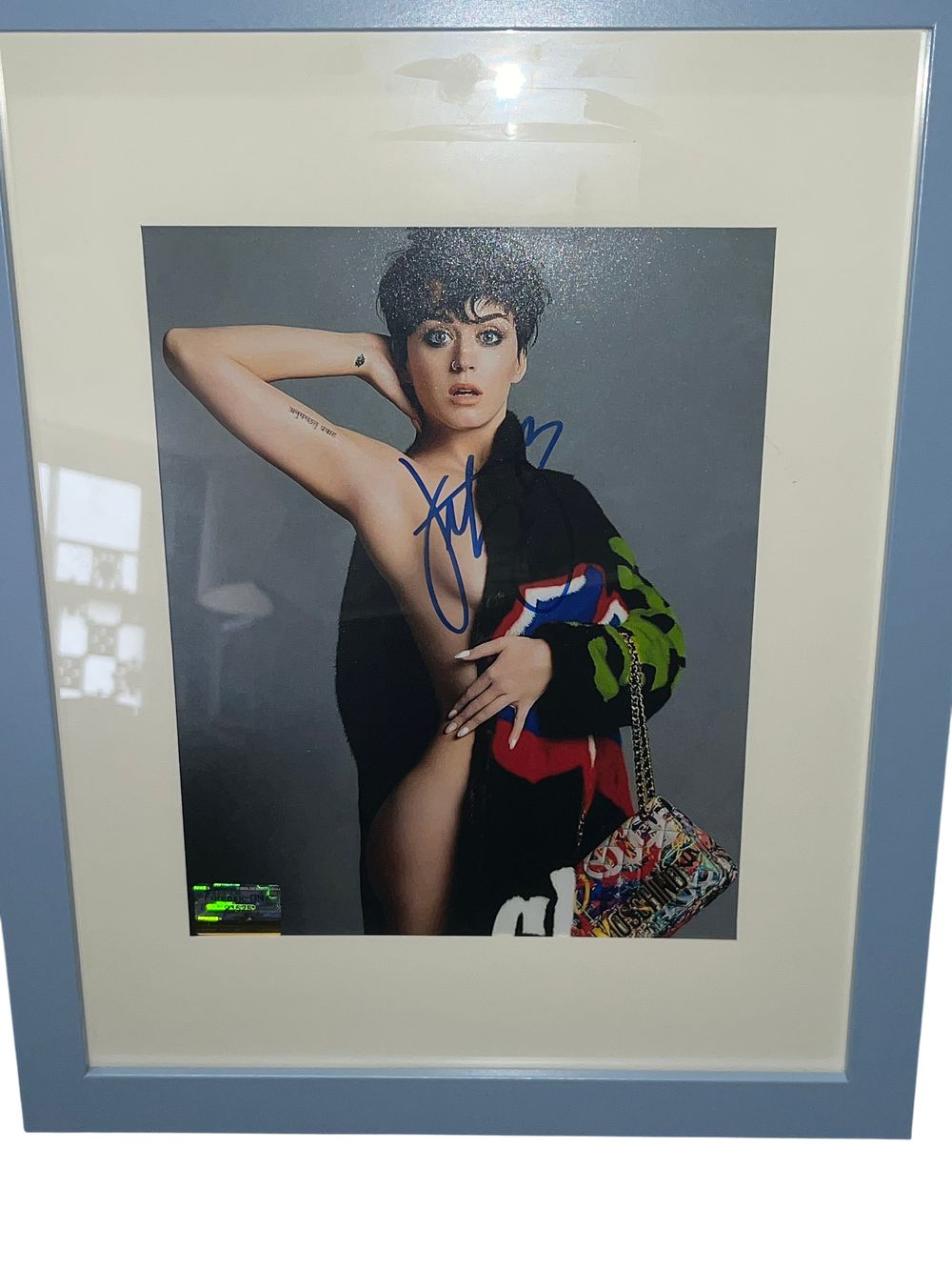 Lot 139: Katy Perry Autographed Color Photograph with Forensic DNA Authentication