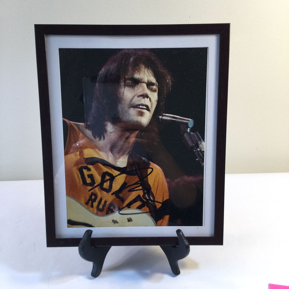 Lot 147: Neil Young Framed Autographed Photograph