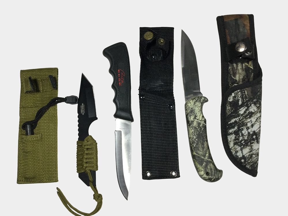Lot 99a: Three Fixed-Blade Knives by Mossy Oak, Rite Edge, and Survivor