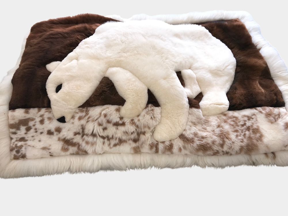 Lot 79: A Pair of Peruvian Alpaca Fur Rugs with Inlaid Animal Designs