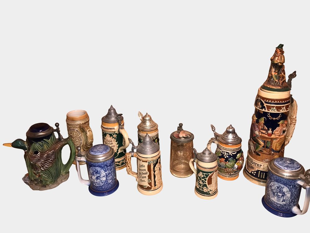 Lot 79a: A Collection of Twelve Assorted German Style Beer Steins and Figural Pitcher