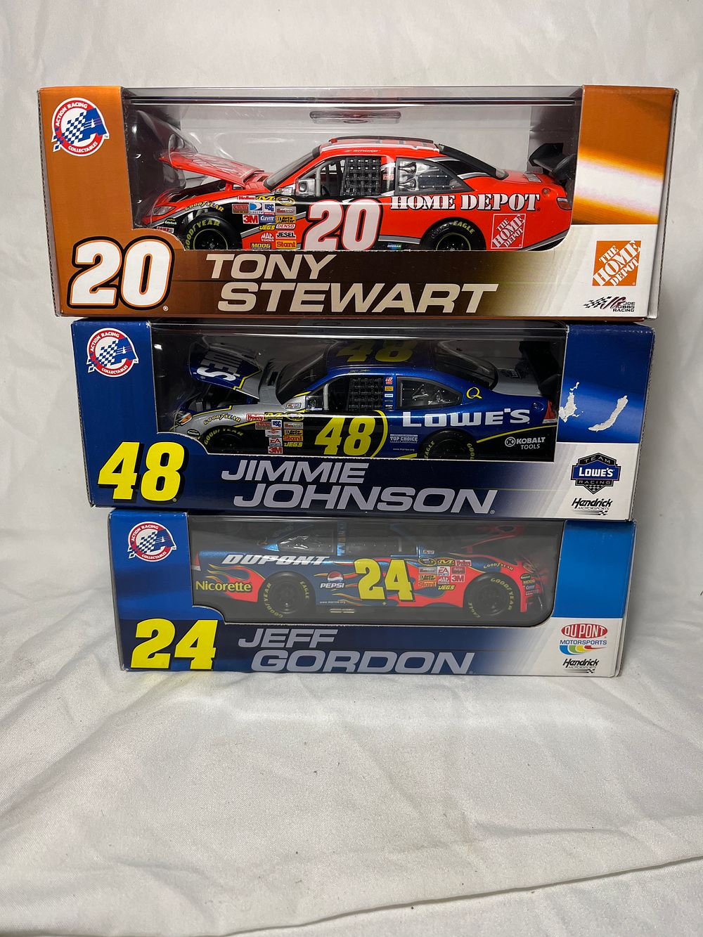 Lot 735: Action Racing 3 Diecast Car Collection