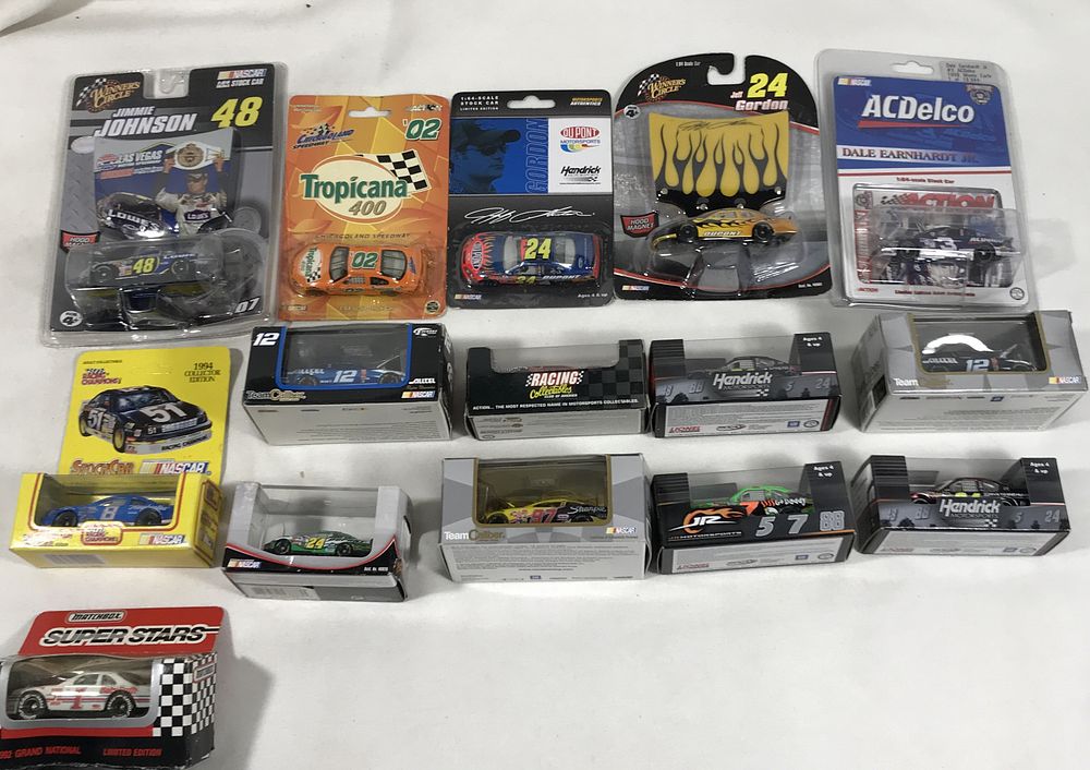 Lot 1282: 45 Die-cast race cars in org packages 1:64 Scale