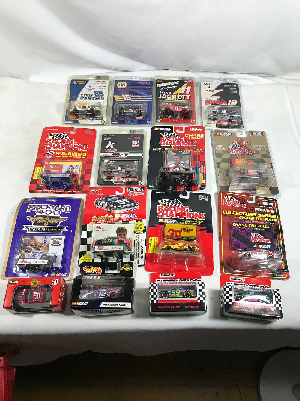 Lot 1309: 16 Race Cars, Die-cast all in original sealed