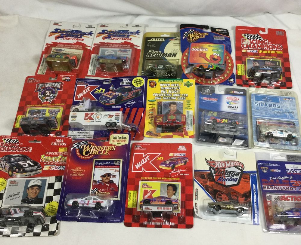 Lot 1320: Die-cast race car collection in sealed packages