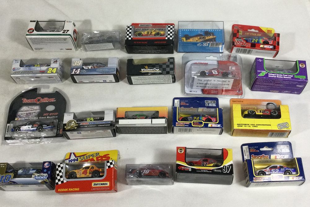 Lot 1322: Die-cast race cars (20) all in sealed packages